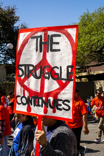 a sign that reads the struggle continues